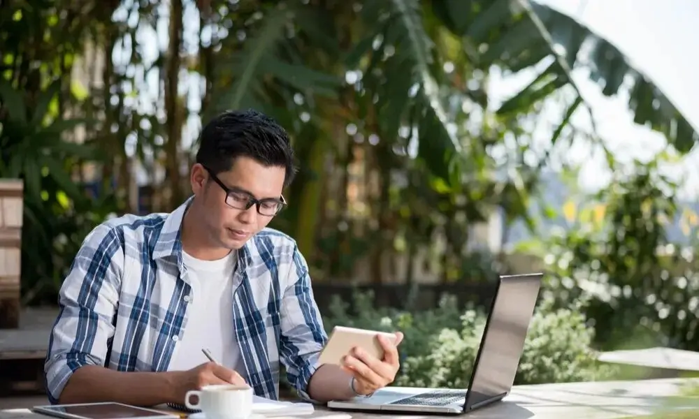 Freelancer working on a laptop in a bright space