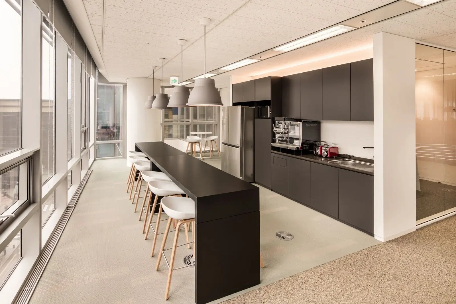A bright and modern kitchen area in an office