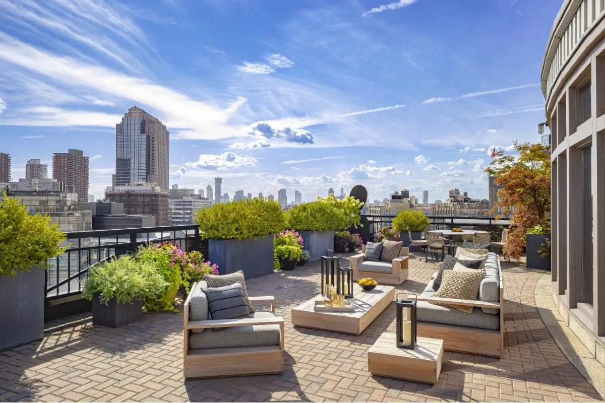 A rooftop terrace with a stunning city view